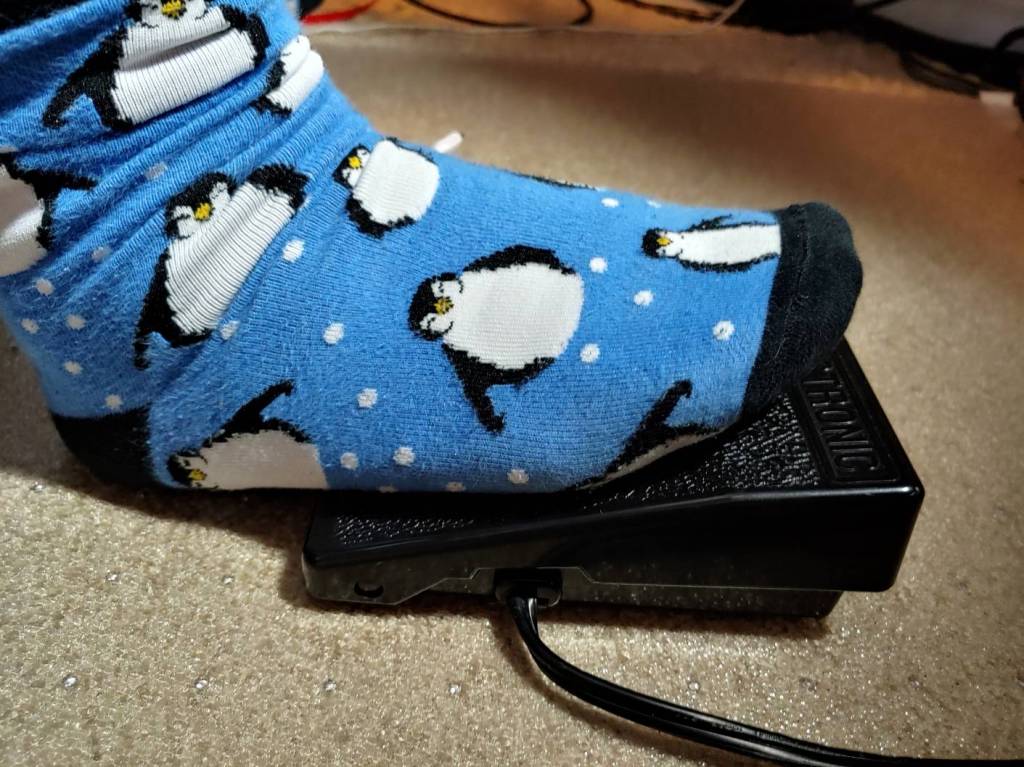 Foot position for a modern plastic foot pedal. Yes, I have penguin socks.