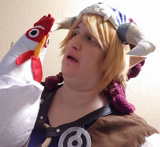 Link looking horrified at a felt plush chicken
